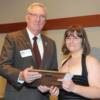 DAHF president Harry Van Den Heuvel presenting plaque to YAA recipient Ariel Evans. 