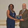2022 Inductee Walter LeKites III is presented his plaque & medallion by DAHF Vice President LeSans Alexander.