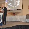 Wingman Brian Woodcock introduces Inductee Albert Burk